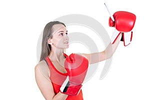 Young woman is boxing in gloves and make picture selfie with phone Isolated white background