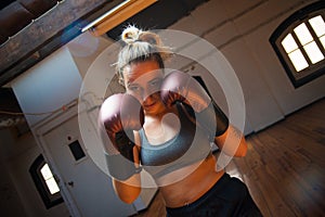 Young woman at boxing training session