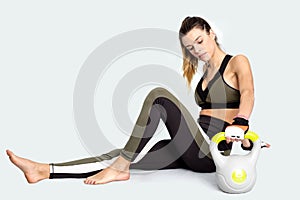 Young woman during a break after workout with kettlebell. Image