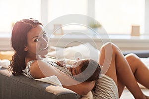 Young Woman Breastfeeding Baby Baby at Home