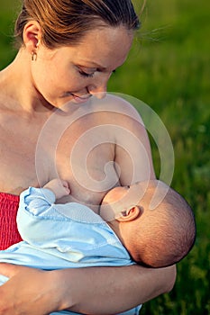 Young woman breastfeeding her baby