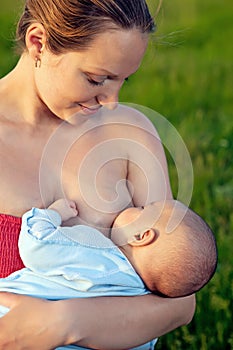 Young woman breastfeeding her baby