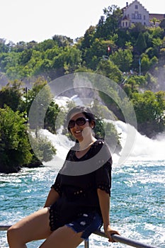 Young woman on the bridge in Rhine falls, Switzerland