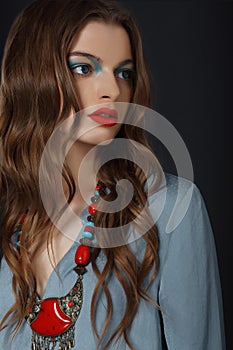 Young Woman with Bright Makeup and Necklace