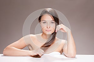 Young woman with brown hair.