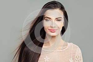 Young woman brunette with long straight blowing hair