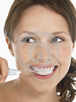 Young Woman Brushing Teeth