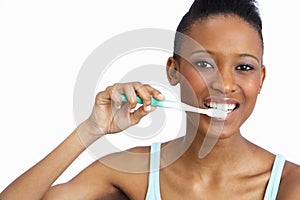 Young Woman Brushing Teeth In Studio