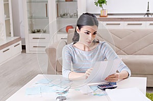 Young woman in budget planning concept