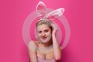 Young woman with bunny ears. Rabbit girl celebrating easter.