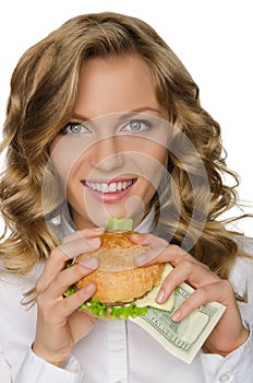 Young woman with burger of dollars