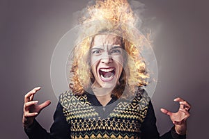 Young woman burning with rage