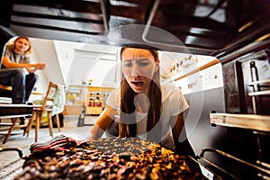 Young Woman With Burnt Pizza