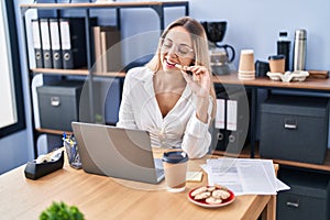 Young woman business worker having breakfast working at office