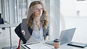 Young woman business worker suffering for backache working at the office