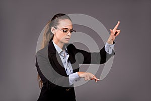 The young woman businesswoman pressing virtual buttons