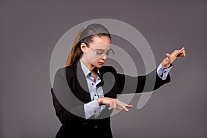The young woman businesswoman pressing virtual buttons