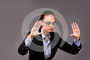 The young woman businesswoman pressing virtual buttons