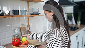 Young woman busy in modern kitchen, attractive girl preparing food