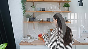 Young woman busy in modern kitchen, attractive girl preparing food