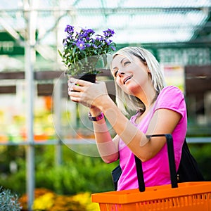 Young woman buying flowers