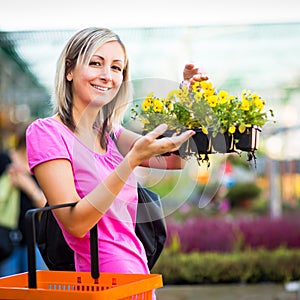 Young woman buying flowers