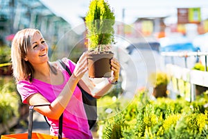 Young woman buying flowers