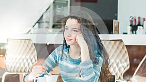 Young woman at the cafe