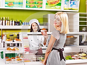 Young woman at cafeteria.