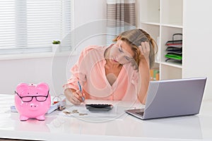 Young Woman Calculating Finance