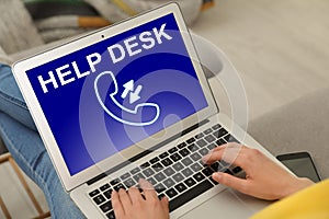 Young woman calling to help desk service with laptop, closeup