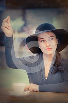 Young Woman Calling a Waiter