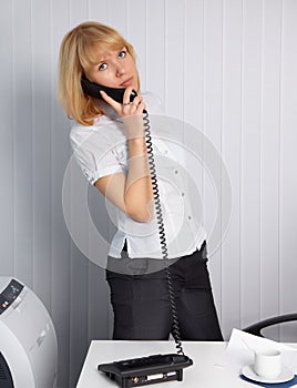 Young woman calls by phone photo