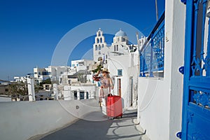 Young woman came to the island of Santorini