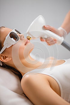 Young woman came to the procedure of laser hair removal