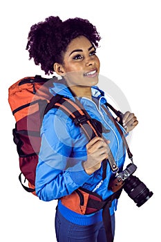 A young woman with camera and backpack