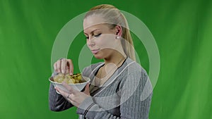 Young woman can not eating the fresh green grapes and she laughs
