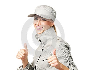 Young woman in a cap showing OK