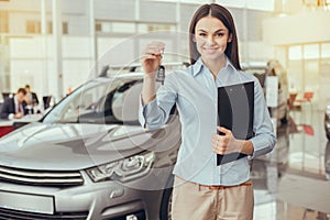Young Woman in a Car Rental Service Assistant Concept