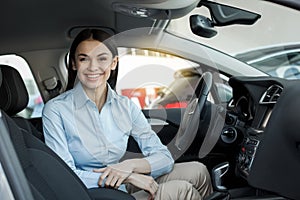 Young Woman in a Car Rental Service Test Drive Concept