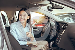 Young Woman in a Car Rental Service Test Drive Concept