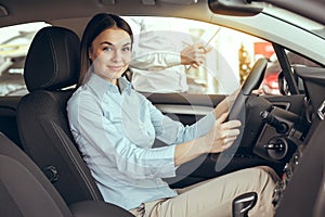 Young Woman in a Car Rental Service Test Drive Concept