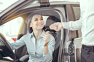 Young Woman in a Car Rental Service Test Drive Concept