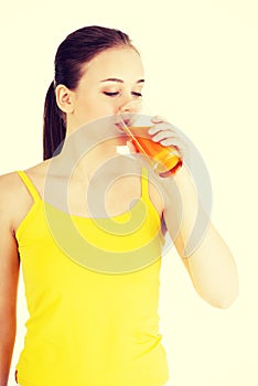 Young woman with the carrots juice