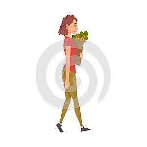 Young Woman Carrying Grocery Paper Bag Full of Healthy Groceries, Household Activity, Housekeeping, Everyday Duties and