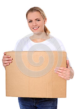 Young woman carrying moving box