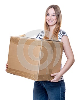 Young woman carrying moving box