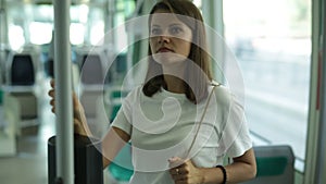 Young woman in casual clothing traveling in public transport