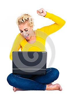 Young Woman Celebrating Success on Laptop