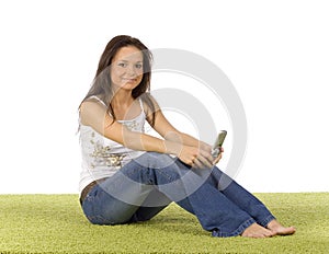 Young woman with cell phone on the green carpet